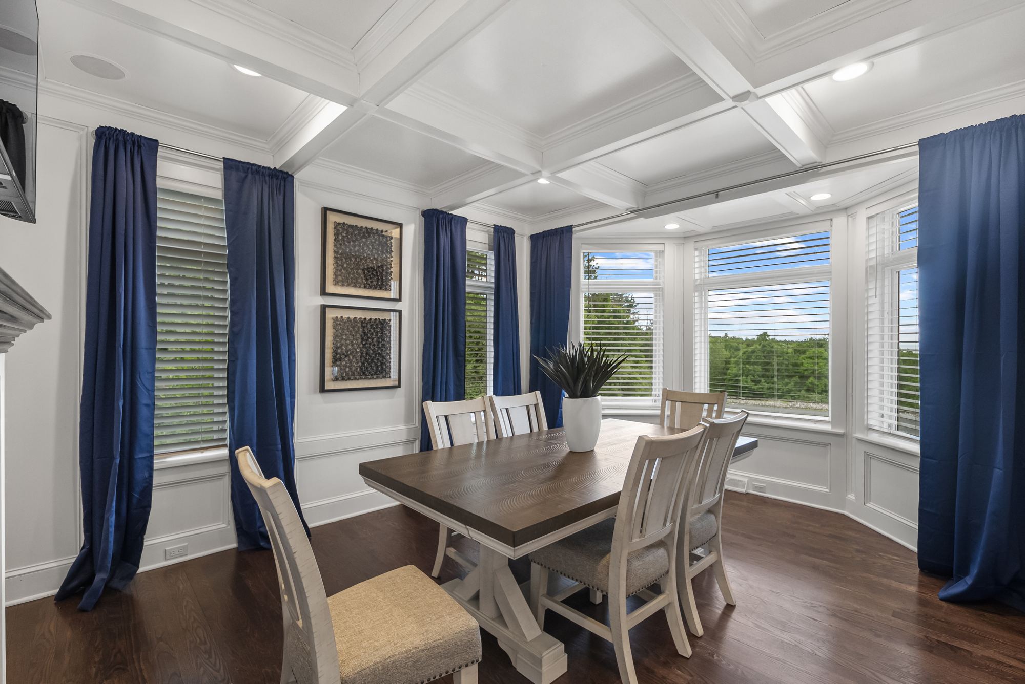 Coffered dining room with navy drapes