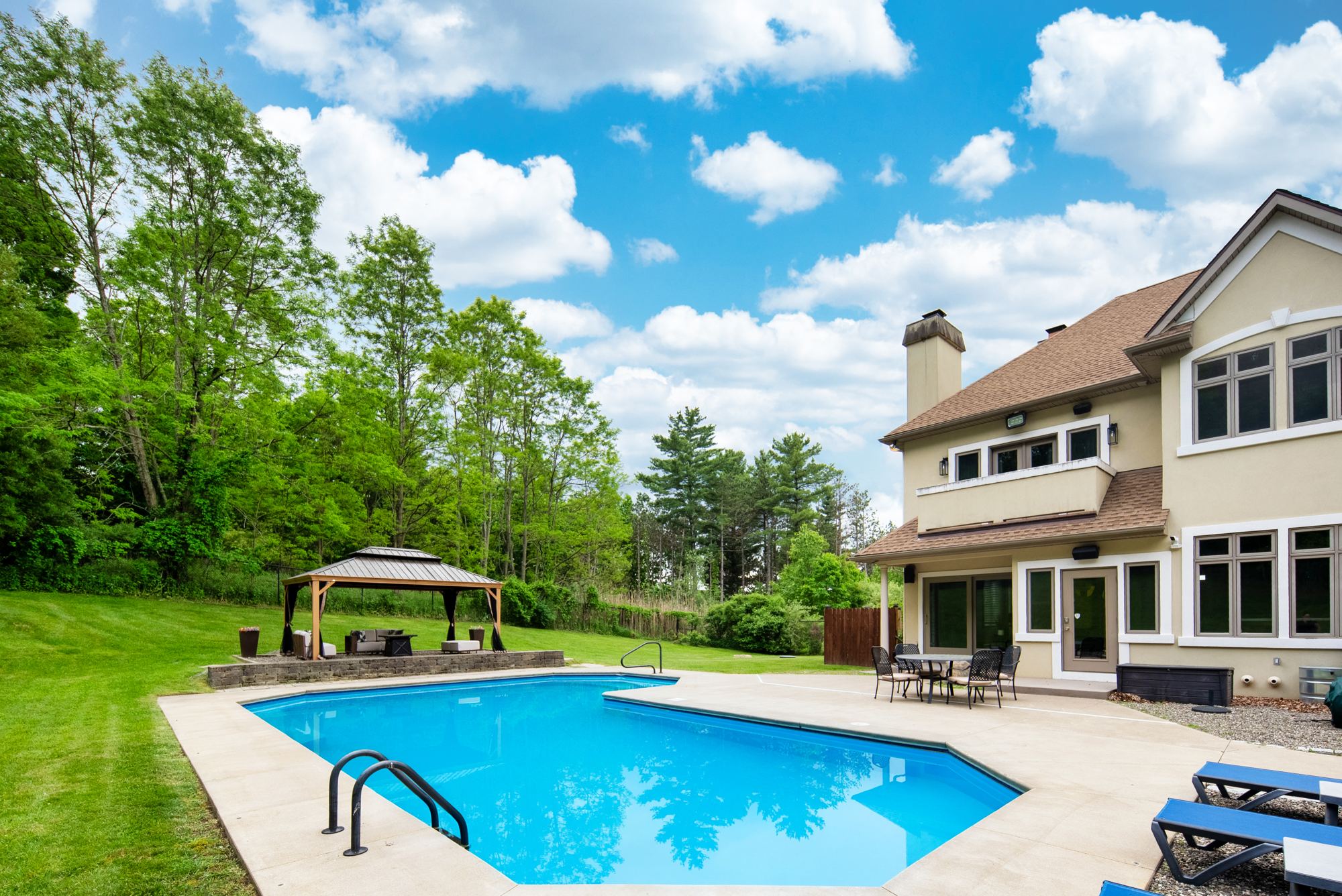 Pool loungers and gazebo